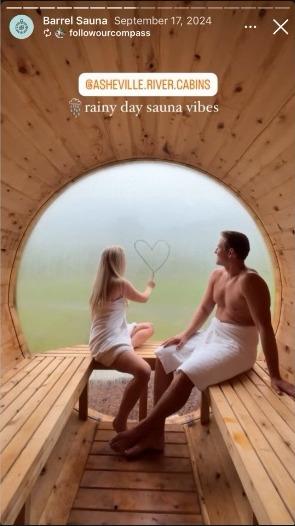An Instagram story of two guests in the barrel sauna, captioned rainy day sauna vibes
